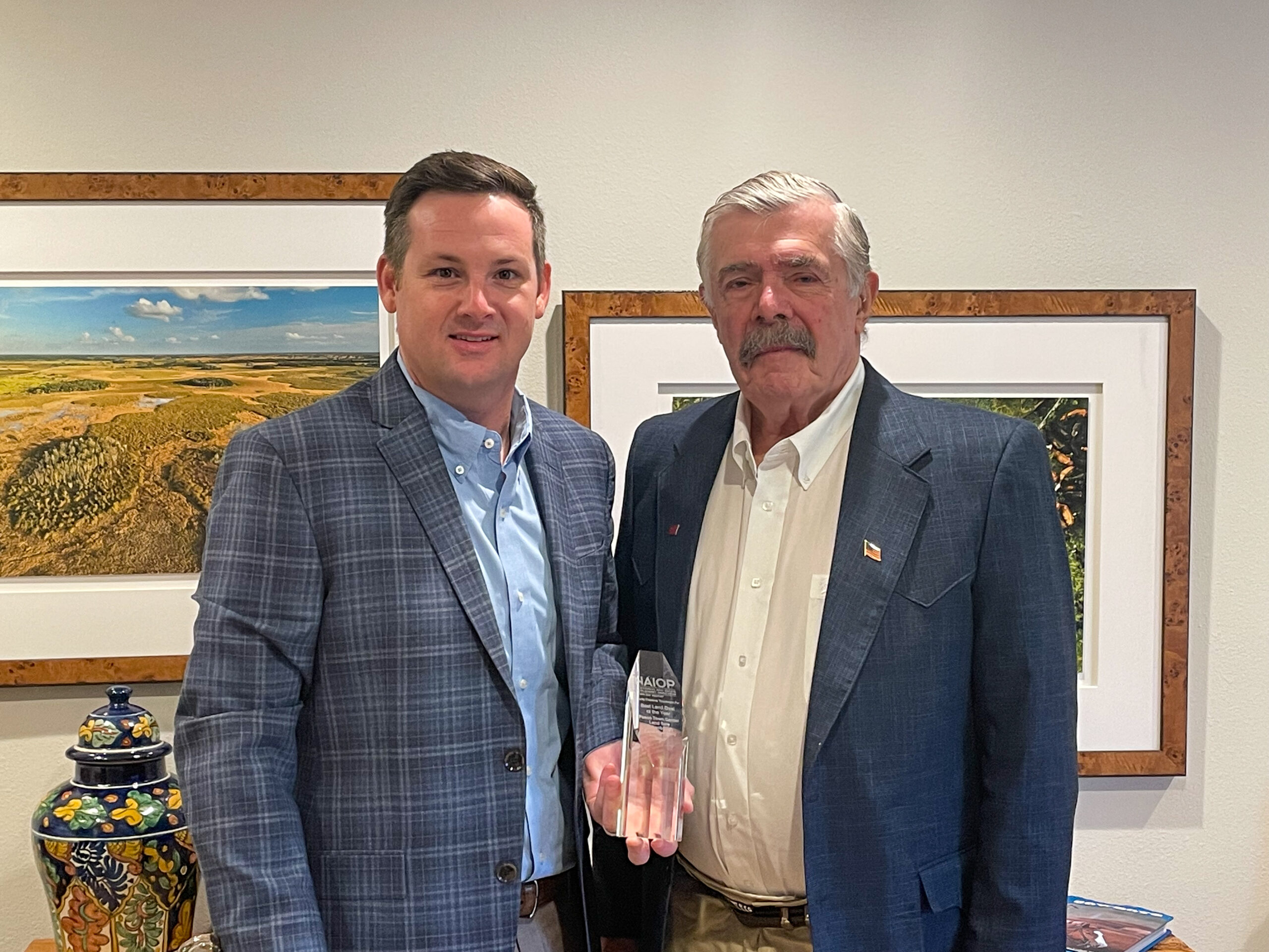 Ryan Sampson and Bill Eshenbaugh holding an FGCAR Pinnacle award